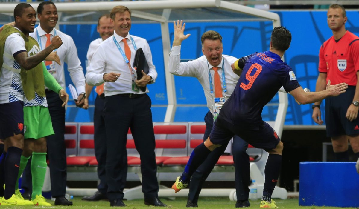 Netherlands' Robin van Persie celebrates with Netherlands' head coach Louis van Gaal after scoring a goal during the group B World Cup soccer match between Spain and the Netherlands at the Arena Ponte Nova in Salvador, Brazil, Friday, June 13, 2014. (AP Photo/Bernat Armangue)